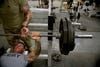 Soldiers at the gym at Lindsey Forward Operating Base in Kandahar province, Afghanistan in September 2012. (Tony Karumba/AFP/Getty Images)
