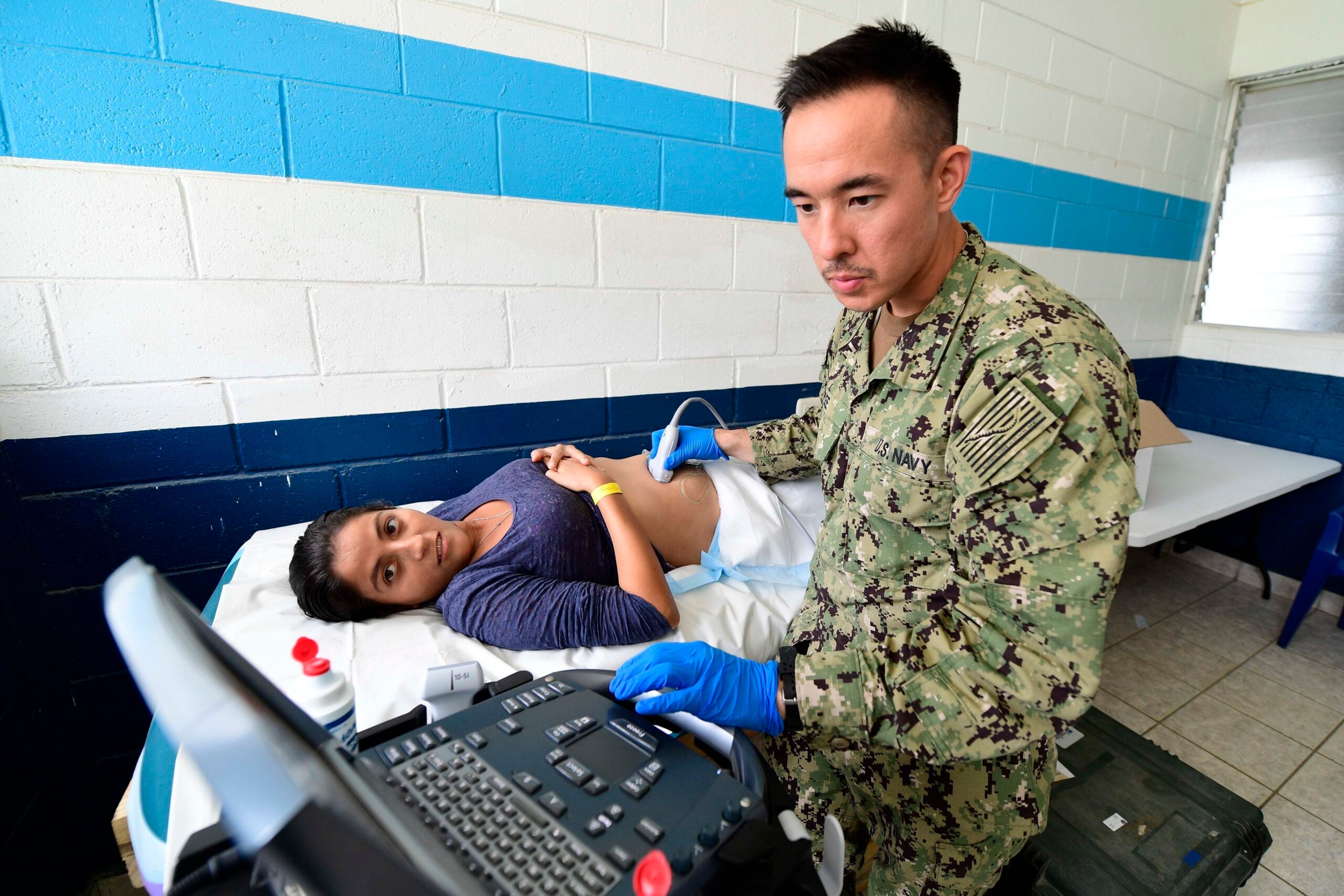 180417-N-VK873-0177 PUERTO BARRIOS, Guatemala (April 17, 2018) Lt. Cmdr. Matthew Lee, of Phoenix, Arizona, performs an ultrasound for a pregnant Guatemalan woman in Puerto Barrios, Guatemala during Continuing Promise 2018. U.S. Naval Forces Southern Command/U.S. 4th Fleet has deployed a force to execute Continuing Promise to conduct civil-military operations including humanitarian assistance, training engagements, and medical, dental, and veterinary support in an effort to show U.S. support and commitment to Central and South America. (U.S. Navy photo by Mass Communication Specialist 2nd Class Kayla Cosby/ Released)