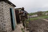 A Ukranian National Guard soldier walks during a reconnaissance mission in a recently retaken village in the outskirts of Kharkiv, east Ukraine, Saturday, May 14, 2022. (AP Photo/Bernat Armangue)