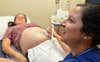 JACKSONVILLE, Fla. (Dec. 22, 2016) – Lt. Jessica Miller, a certified nurse midwife in Naval Hospital Jacksonville’s pregnancy Integrated Practice Unit (IPU), assesses fetal presentation for Deanna Preston. Value-based care organizes care around patients with similar needs and medical conditions. The goal is improved patient outcomes, increased readiness, higher patient satisfaction, and improved value with optimal resource utilization. (U.S. Navy photo by Jacob Sippel, Naval Hospital Jacksonville Public Affairs/Released).