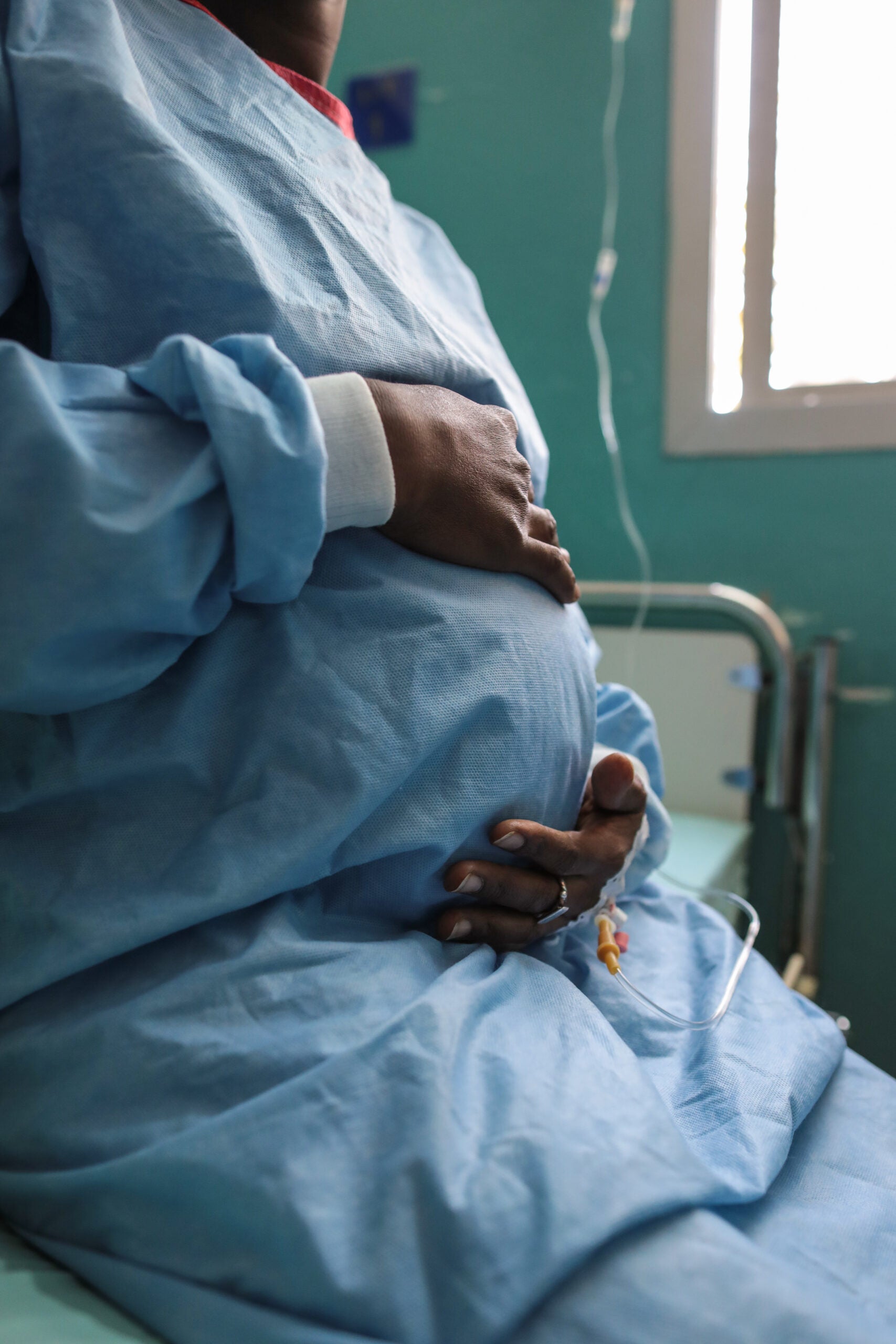 Veronique Sagna, holds her unborn child just prior to a cesearean section delivery due to a rare occurrence known as abdominal pregnancy, Feb. 8, 2018, at Hospital Militaire De Ouakam, Dakar, Senegal. Abdominal pregnancy is a rare form of ectopic pregnancy with very high chance of mortality for both the mother and the fetus. Sagna's delivery was performed by U.S. Army and Senegalese medical personnel during MEDRETE 18-1. MEDRETE is a combined effort between the Senegalese government, U.S. Army Africa, and the Vermont National Guard. MEDRETE 18-1 is the first in a series of medical readiness training exercises that U.S. Army Africa is scheduled to facilitate within various countries in Africa, and serves as an opportunity for the partnered militaries to hone and strengthen their general surgery and trauma skills while reinforcing the partnership between the countries. The mutually beneficial exercise brings together Senegalese military and U.S. Army medical professionals to foster cooperation while conducting medical specific tasks. (U.S. Army photo by Sgt. Micah Merrill)