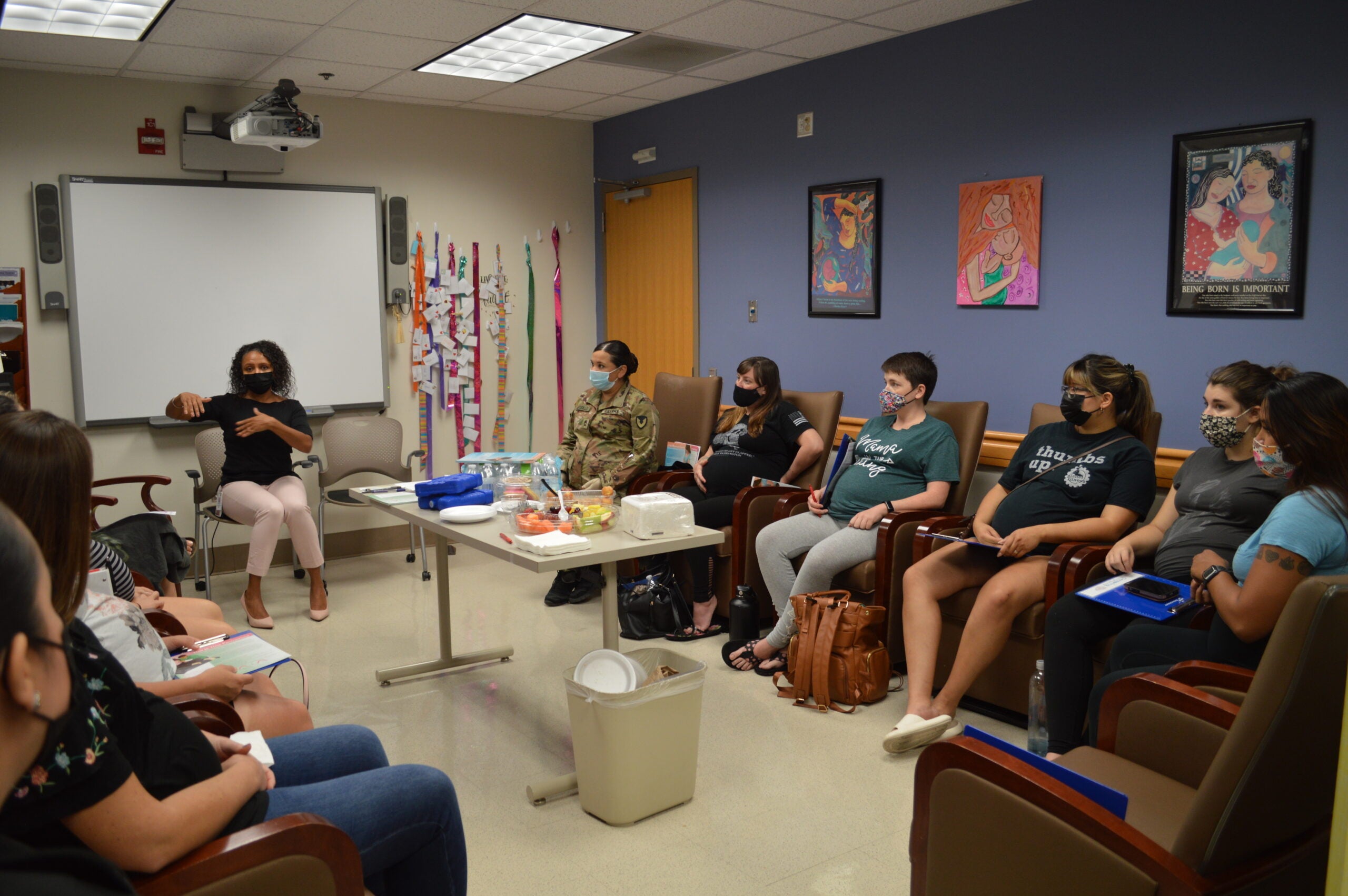 Virginia Monteiro-Walker, certified nurse midwife, leads a discussion during a pregnancy group at Brooke Army Medical Center, Joint Base San Antonio-Fort Sam Houston, Texas, May 16, 2022. Group prenatal care models are designed to improve patient education and include opportunities for social support while maintaining the risk screening and physical assessment of individual prenatal care. (U.S. Army Photo by Lori Newman)