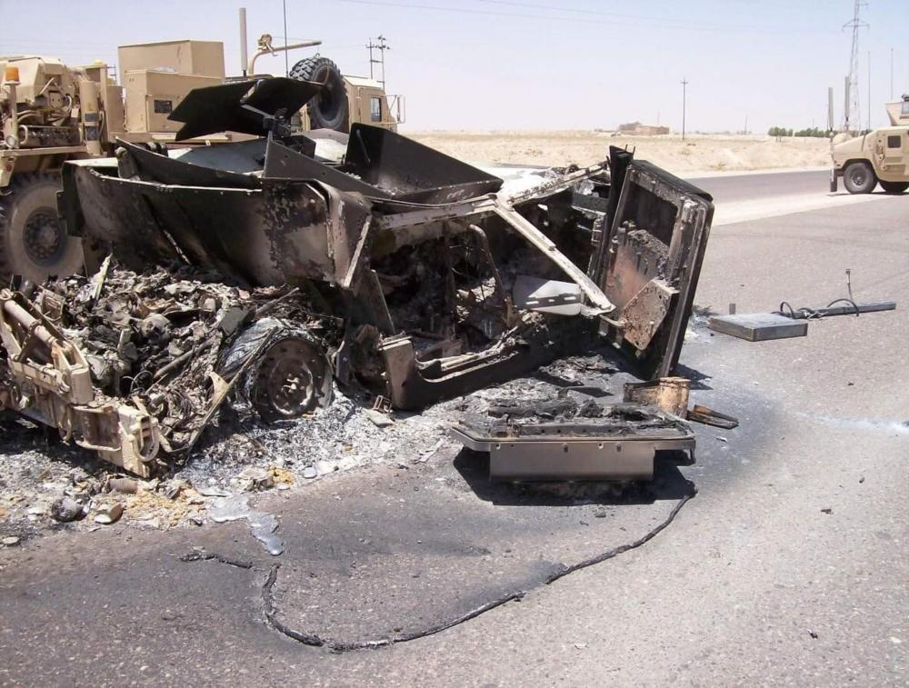 Wreckage of a vehicle hit with an improvised explosive device (IED) near Camp Bucca, Iraq June 15, 2007. (Courtesy photo by Chief Master Sgt. Cesar Flores)