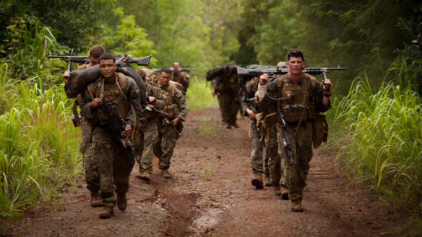 U.S. Marine Corps infantry squad leaders assigned to School of Infantry West, Detachment Hawaii, move to their next position during the Advanced Infantry Course (AIC) aboard Kahuku Training Area, Hawaii, July 18, 2016. AIC is intermediate training designed to enhance and test the Marine's skills and leadership abilities as squad leaders in a rifle platoon. (Cpl. Aaron S. Patterson/U.S. Marine Corps)
