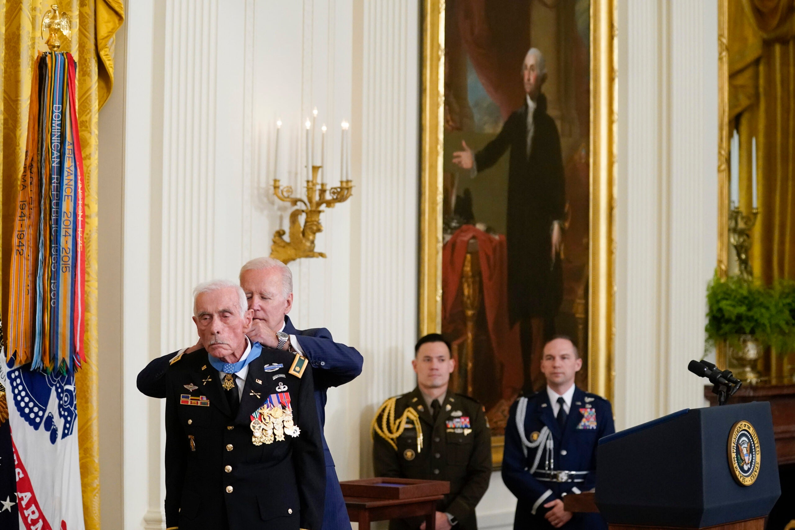 President Joe Biden awards the Medal of Honor to retired Maj. John Duffy for his actions on April 14-15 1972, during the Vietnam War, during a ceremony in the East Room of the White House, Tuesday, July 5, 2022, in Washington. (AP Photo/Evan Vucci)
