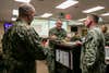 U.S. Navy Vice Admiral Yancy B. Lindsey, middle, commander of Navy Installations Command, speaks with U.S. Marine Corps Maj. Sean P. Day, left, operations officer for Combat Logistics Regiment 3, 3rd Marine Logistics Group (MLG), and Capt. Erik A. Spitzer, middle, commander of Joint Base Pearl Harbor-Hickam, during an Emergency Operations Center meeting on Joint Base Pearl Harbor-Hickam, Oahu, Hawaii, Dec. 11, 2021. U.S. Marines with 3rd MLG, as part of Task Force KULEANA, are providing support services such as drinking water, field expedient showers and laundry facilities to the residents of Joint Base Pearl Harbor-Hickam affected by the ongoing water issue. 3rd MLG, based out of Okinawa, Japan, is a forward deployed combat unit that serves as III Marine Expeditionary Force’s comprehensive logistics and combat service support backbone for operations throughout the Indo-Pacific area of responsibility. (U.S. Marine Corps photo by Sgt. Hailey D. Clay)