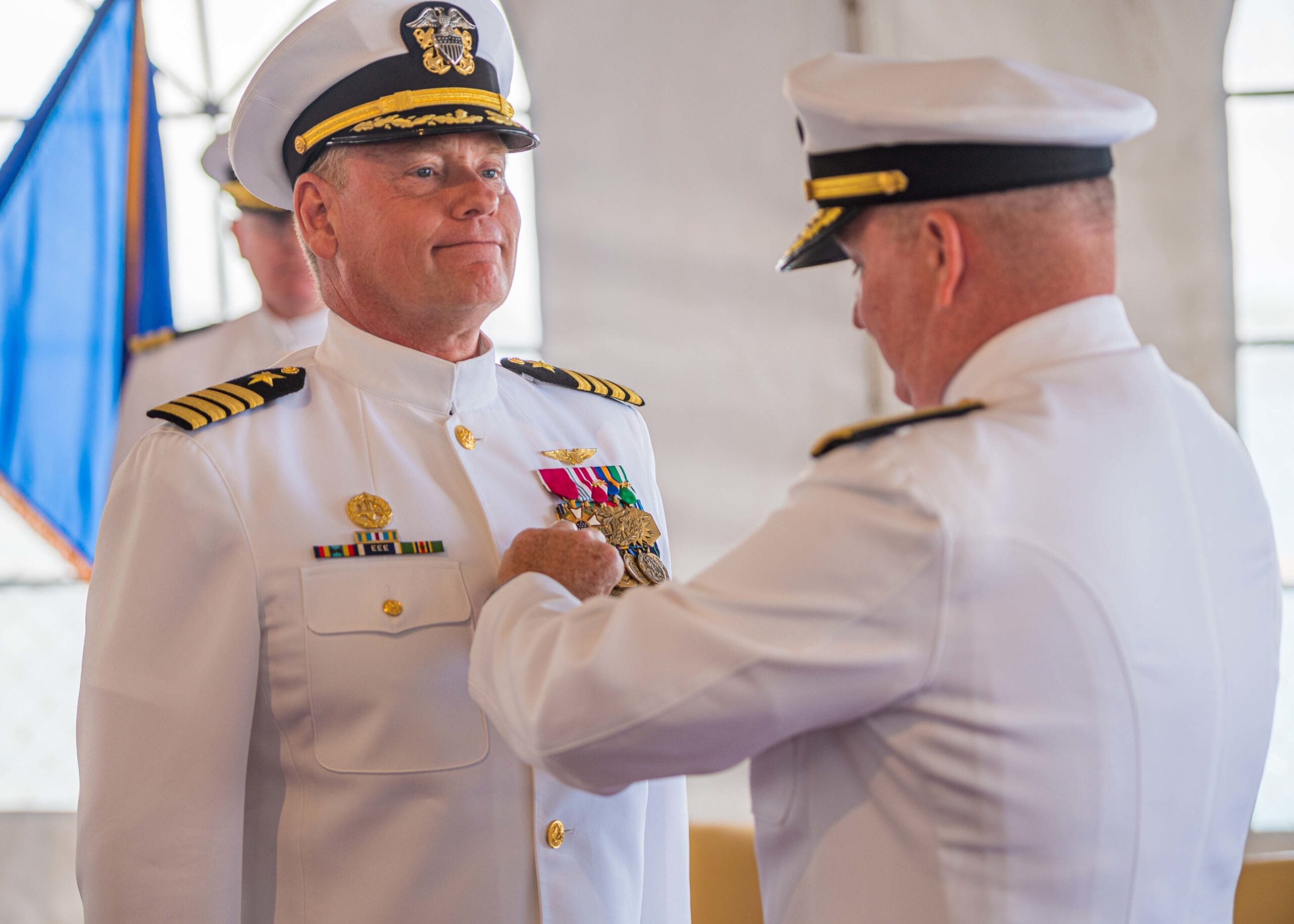 220614-N-KN989-1005 JOINT BASE PEARL HARBOR-HICKAM, Hawaii (June 14, 2022) Rear Adm. Timothy Kott, Commander, Navy Region Hawaii, presents Capt. Erik Spitzer, Commander, Joint Base Pearl Harbor-Hickam, the Legion of Merit Medal during a change of command ceremony aboard USS Missouri (BB-63). Spitzer was relieved by Capt. Mark Sohaney during the official change of command ceremony June 14, 2022. Joint Base Pearl Harbor-Hickam delivers the best service in base operating support to supported and tenant commands to enable operational mission success while simultaneously providing the highest quality of installation services, facilities support and quality of life programs.(U.S. Navy photo by Melvin J. Gonzalvo)