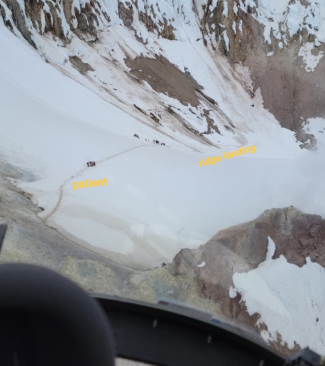 The view from the Black Hawk cockpit shortly after taking off from a precarious ridgeline landing site to drop off medics to care for a mountain climber in need of treatment. (Photo courtesy Chief Warrant Officer 3 Michael Newgard)