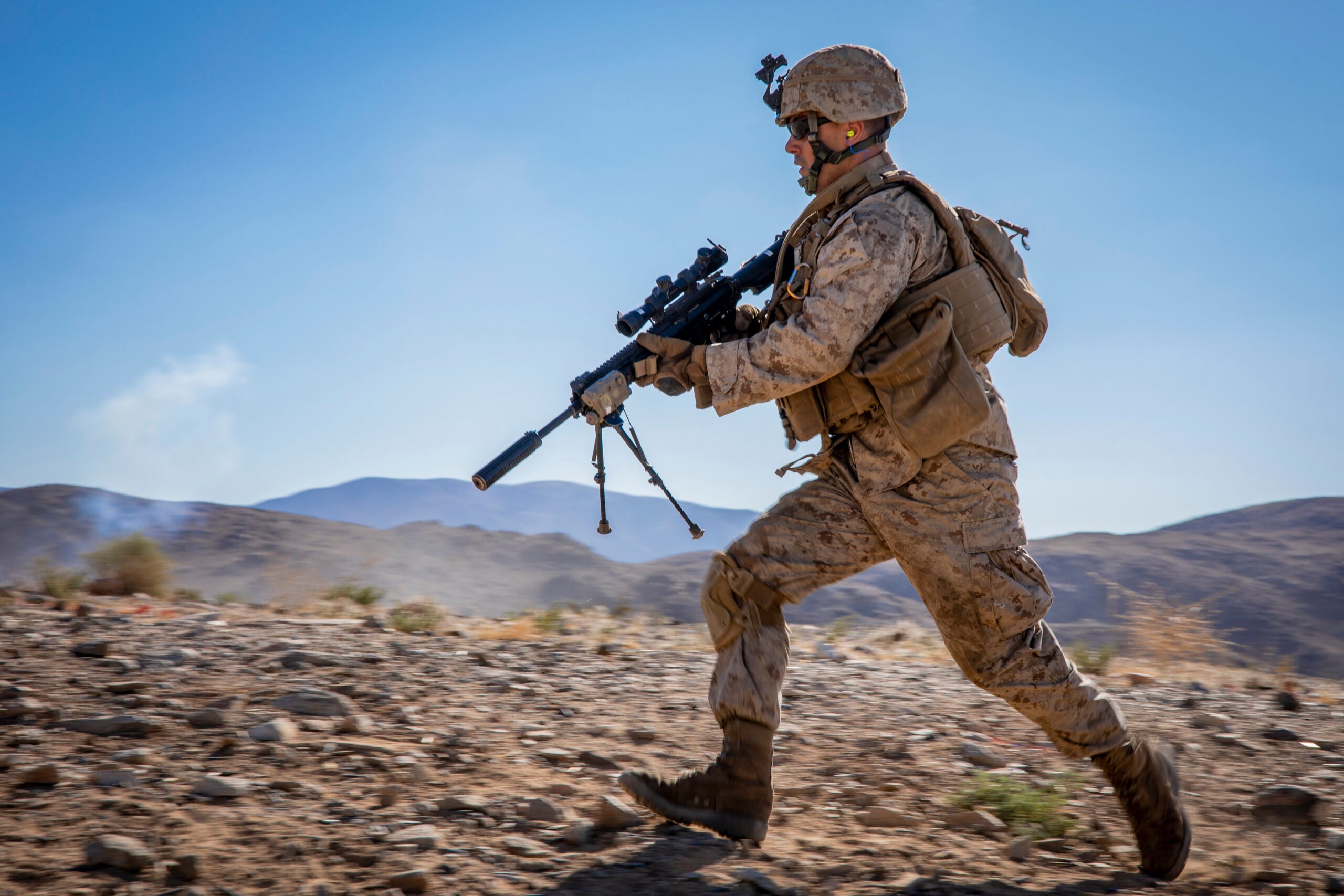 A U.S. Marine Corps infantry rifleman with 1st Battalion, 25th Marine Regiment, 4th Marine Division, moves towards a simulated target during Integrated Training Exercise 5-19 at Marine Corps Air Ground Combat Center Twentynine Palms, Calif., July 27, 2019. ITX 5-19 is a live-fire and maneuver combined arms exercise designed to train battalion and squadron-sized units in tactics, techniques, and procedures required to provide a sustainable and ready operational reserve for employment across the full spectrum of crisis and global engagement. (U.S. Marine Corps photo by Lance Cpl. Jose Gonzalez)