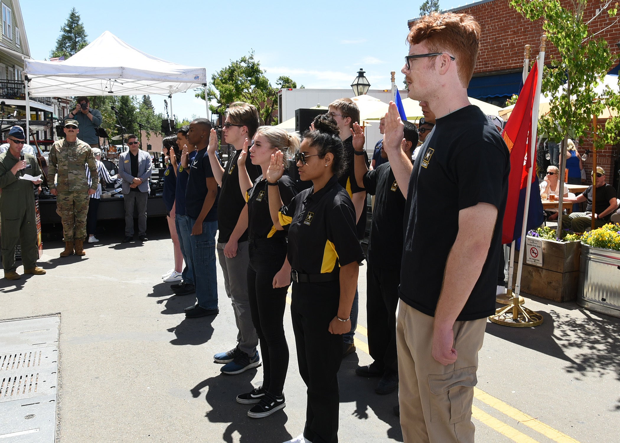 GRASS VALLEY, Calif. - U.S. Army Future Soldiers take an oath of enlistment at the mainstage of the GV Armed Forces Day to show their commitment to the U.S. Army. GV Armed Forces Day celebration was held in honor of the men and women who serve in the U.S. military to include opening ceremony colors, booths from all service branches, music performances, static and vehicle displays in additional to two aerial flyovers.  (U.S. Army photo by Tim Jensen/Released)