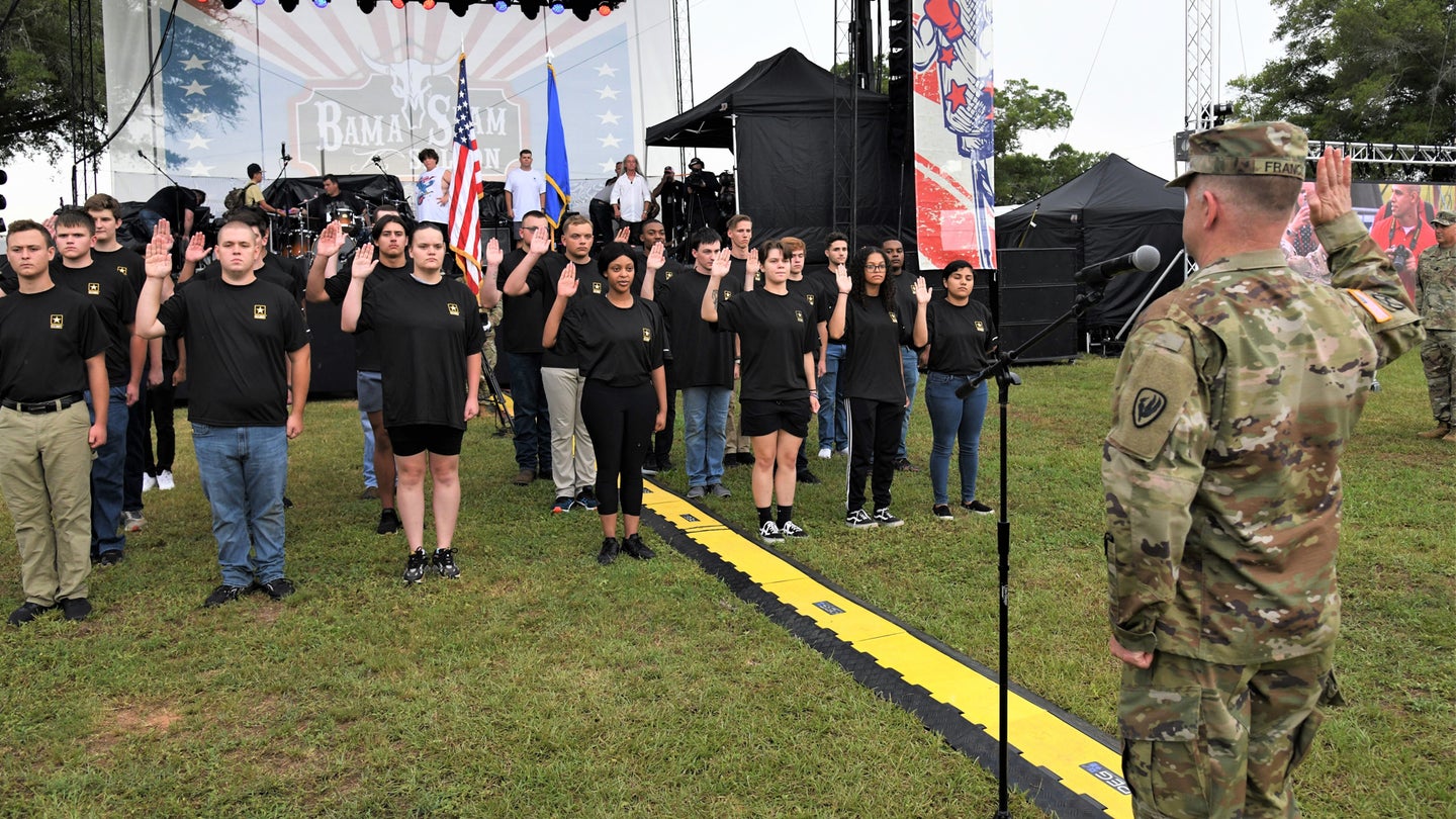 Maj. Gen. David J. Francis, U.S. Army Aviation Center of Excellence and Fort Rucker commander, leads future Soldiers as they recite the Oath of Enlistment at the opening of Fort Rucker's annual Freedom Fest "Rumble Over Rucker" event to kick off the Independence Day weekend June 30, 2022. (Kelly Morris/U.S. Army)