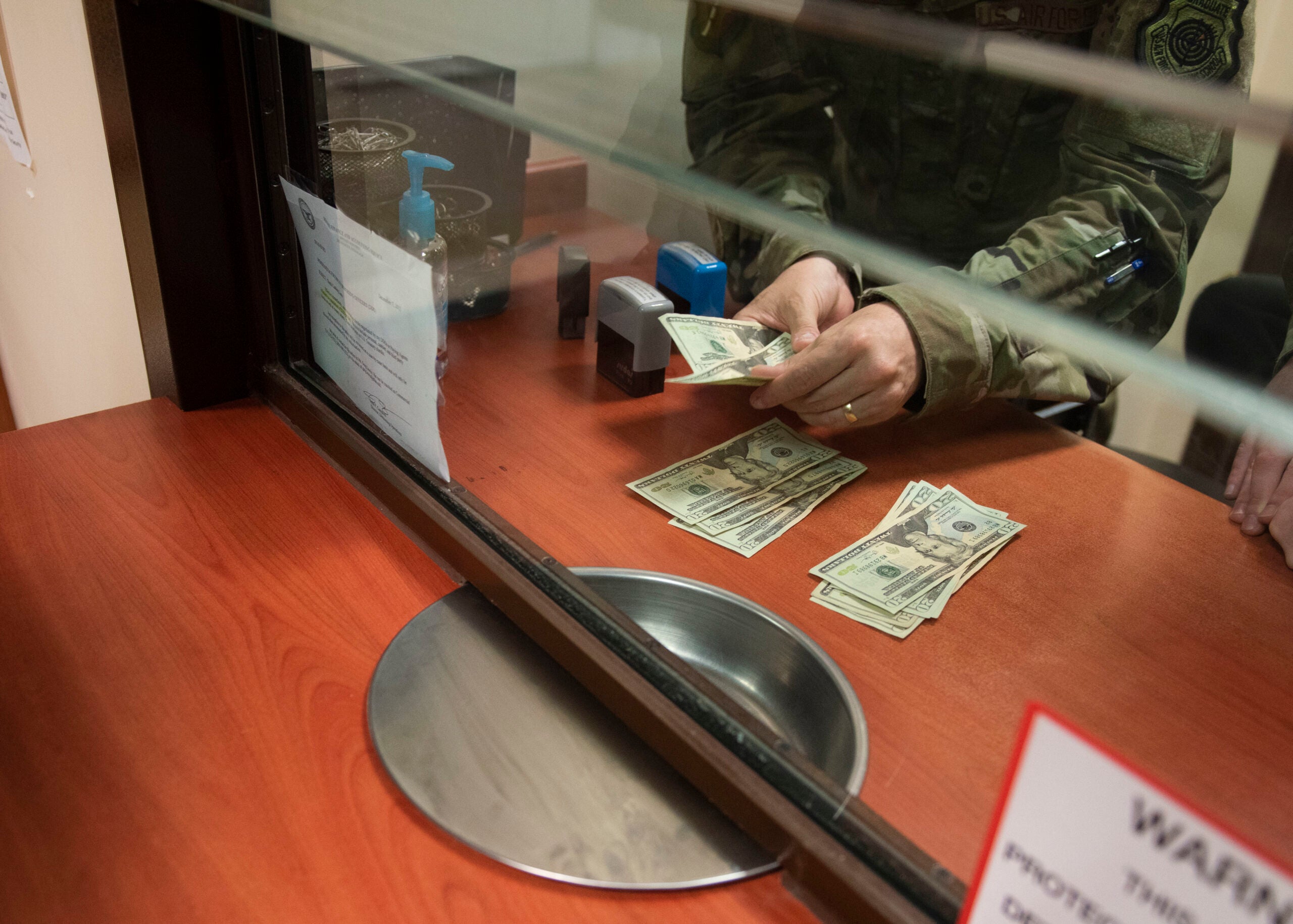 U.S. Air Force Col. John Creel, 39th Air Base Wing commander, counts cash for a customer’s withdrawal request as part of his immersion tour with the wing staff agency July 30, 2020, at Incirlik Air Base, Turkey. The 39th CPTS finance customer service team provides financial assistance for over 2,500 members at Incirlik Air Base. (U.S. Air Force photo by Senior Airman Matthew Angulo)