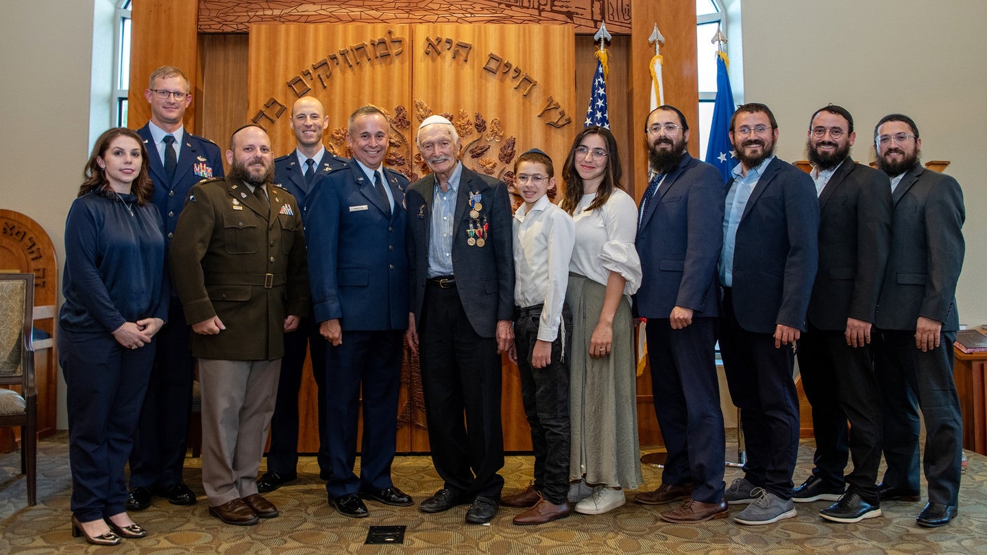 U.S. Army Air Corps 1st Lt. Gerald Teldon (center), retired, poses for a group photo after his awards ceremony for his honorable service as a pilot on July 29, 2022, at the Chabad Center for Jewish Life and Learning, San Antonio, Texas. (Sarayuth Pinthong/U.S. Air Force)