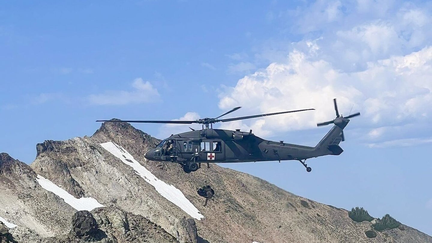 A HH-60 Black Hawk helicopter from U.S. Army Air Ambulance Detachment, 2-158 Assault Helicopter Battalion, 16th Combat Aviation Brigade rescues a hiker in Washington State. (16th Combat Aviation Brigade)