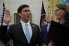 WASHINGTON, DC - JULY 23: Mark Esper is sworn in to be the new U.S. Secretary of Defense as wife Leah Esper and U.S. President Donald Trump look on July 23, 2019 in the Oval Office of the White House in Washington, DC. Esper succeed James Mattis to become the 27th U.S. Defense Secretary. (Photo by Alex Wong/Getty Images)