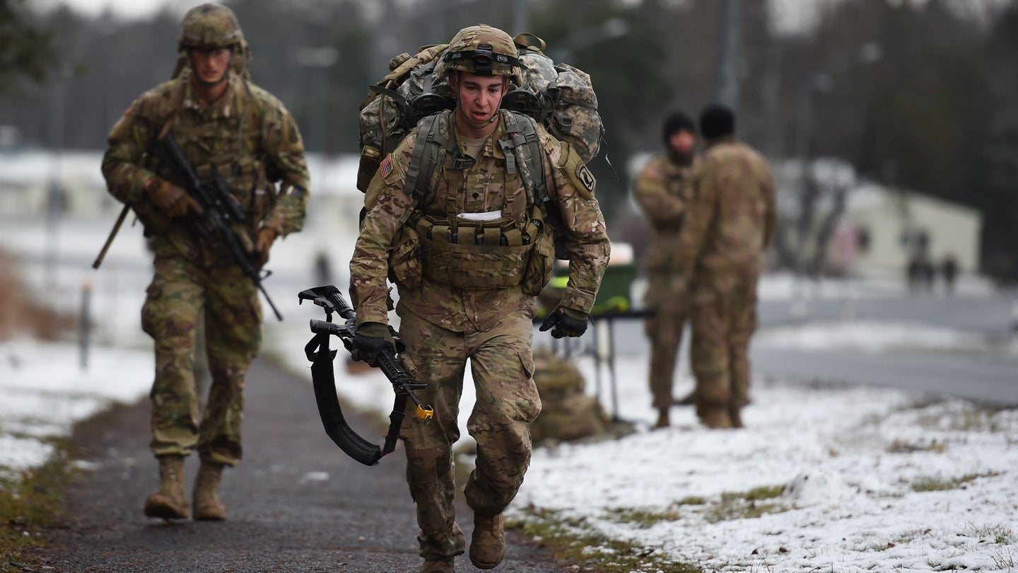 U.S. Army paratroopers assigned to 2nd Battalion, 503rd Infantry Regiment, 173rd Airborne Brigade, run during a 12-mile ruck march as part of the brigade's Expert Infantryman Badge testing phase at the 7th Army Joint Multinational Training Command’s Grafenwoehr Training Area in Germany, Feb. 5, 2016. (Spc. Gertrud Zach/U.S. Army)
