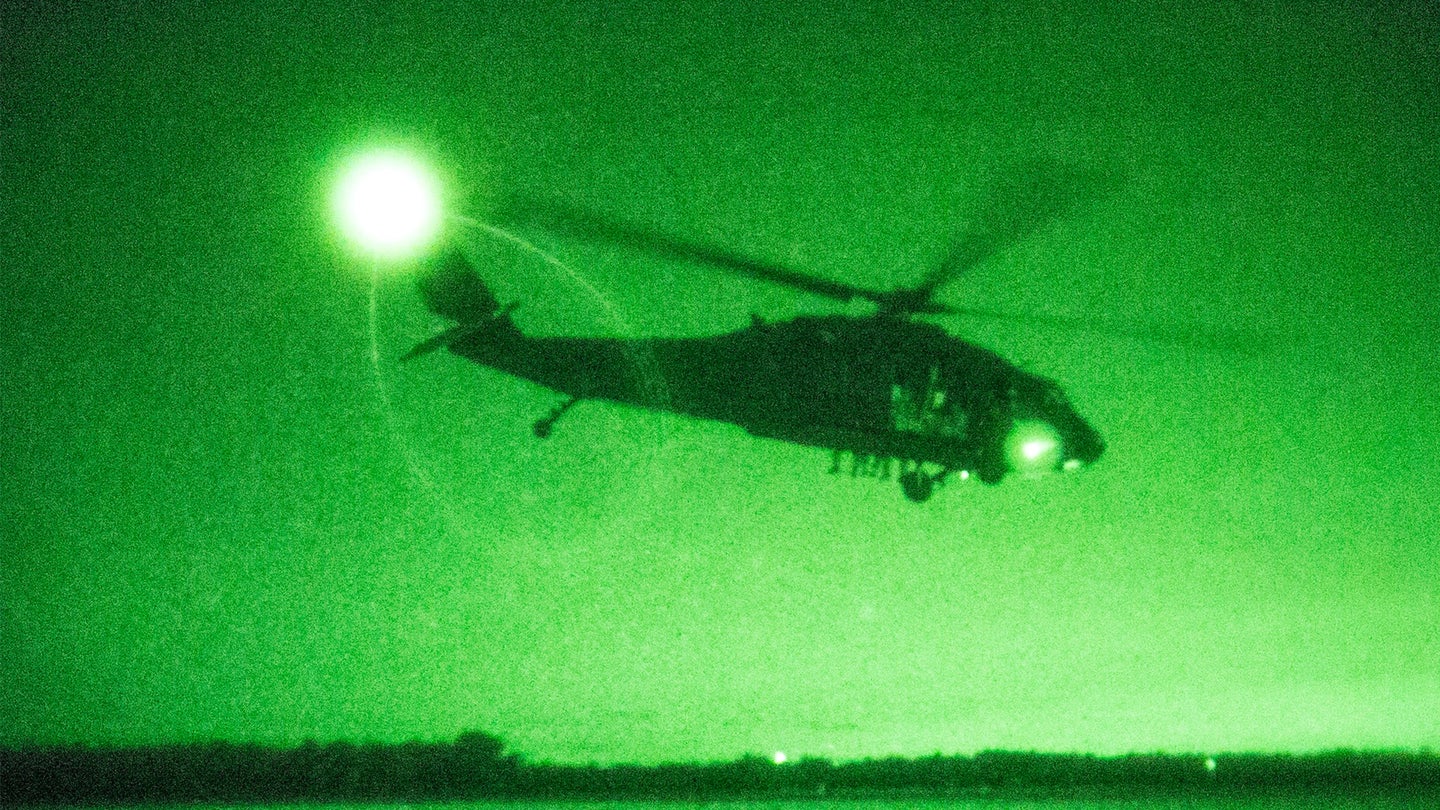 Airmen with the 227th Air Support Operations Squadron, New Jersey Air National Guard, perform the night exercise portion of Fast-Rope Insertion Extraction System (FRIES) training from a UH-60 Black Hawk helicopter with the 1-150th Assault Helicopter Battalion, New Jersey Army National Guard, at Joint Base McGuire-Dix-Lakehurst, N.J., April 21, 2015. (Master Sgt. Mark C. Olsen/U.S. Air National Guard)