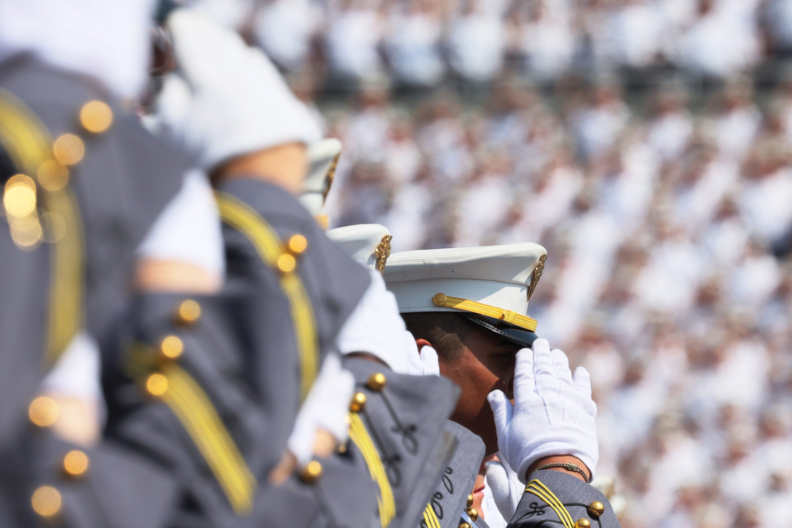 WEST POINT, NEW YORK - MAY 21:  West Point graduates stand and salute as the National Anthem is played during the 2022 West Point Commencement Ceremony at West Point Military Academy on May 21, 2022 in West Point, New York. Mark A. Milley, Chairman of the Joint Chiefs of Staff, delivered the graduation address to the 1014 cadets of the U.S. Military Academy’s Class of 2022.  (Photo by Michael M. Santiago/Getty Images)