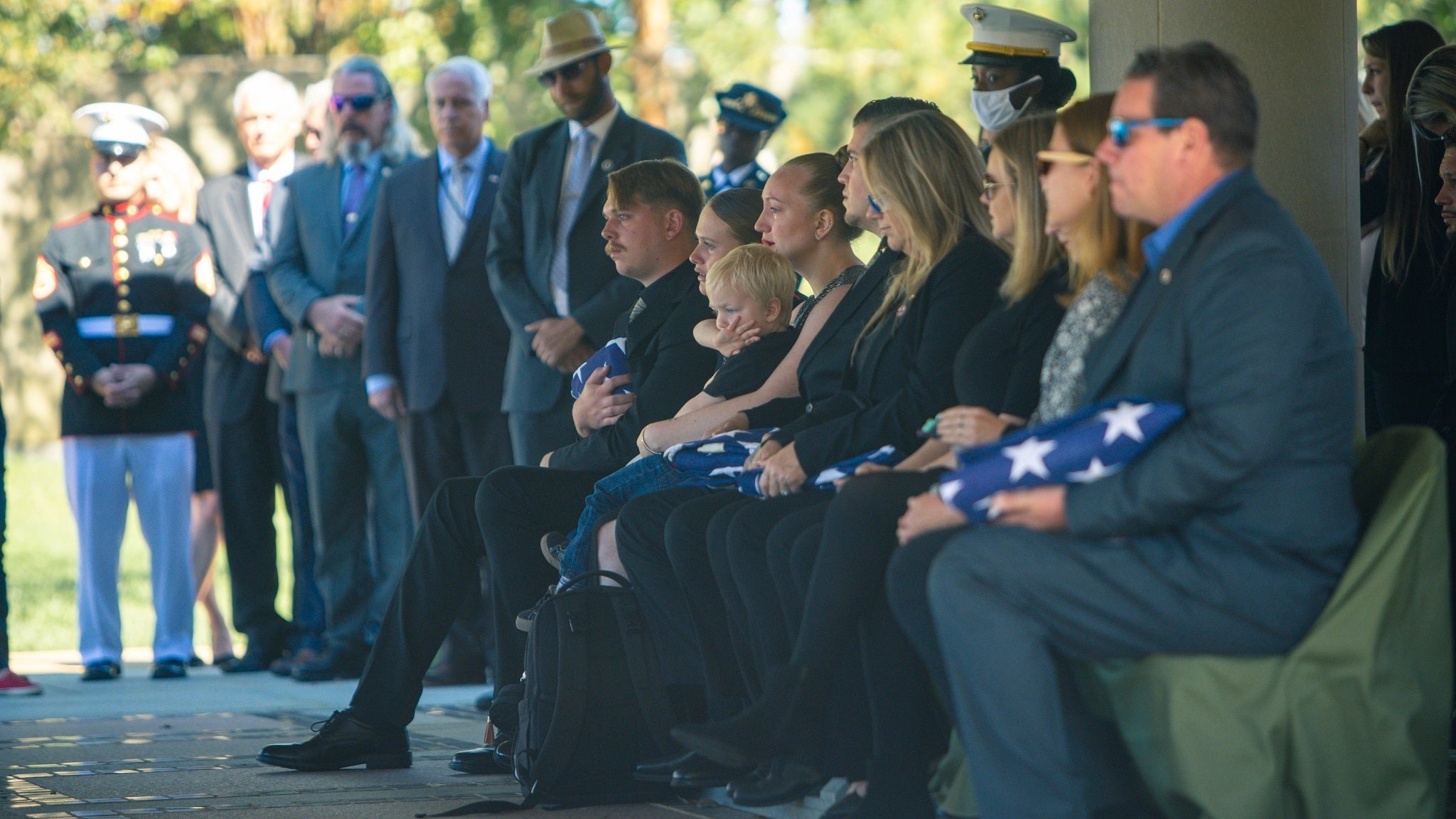 Friends and family pay their respects during a full honors funeral for Sgt Nicole Gee at Arlington National Cemetery, Arlington, Va., Sept. 29, 2021. Sgt. Gee was a member of Combat Logistics Battalion 24, 2nd Marine Logistics Group, attached to the 24th Marine Expeditionary Unit based in Camp Lejeune, N.C. Sgt. Gee was one of 13 service members killed during the non-combatant evacuation operations at the Hamid Karzai Airport in Kabul, Afghanistan. (U.S. Marine Corps photo by Staff Sgt. Akeel Austin)