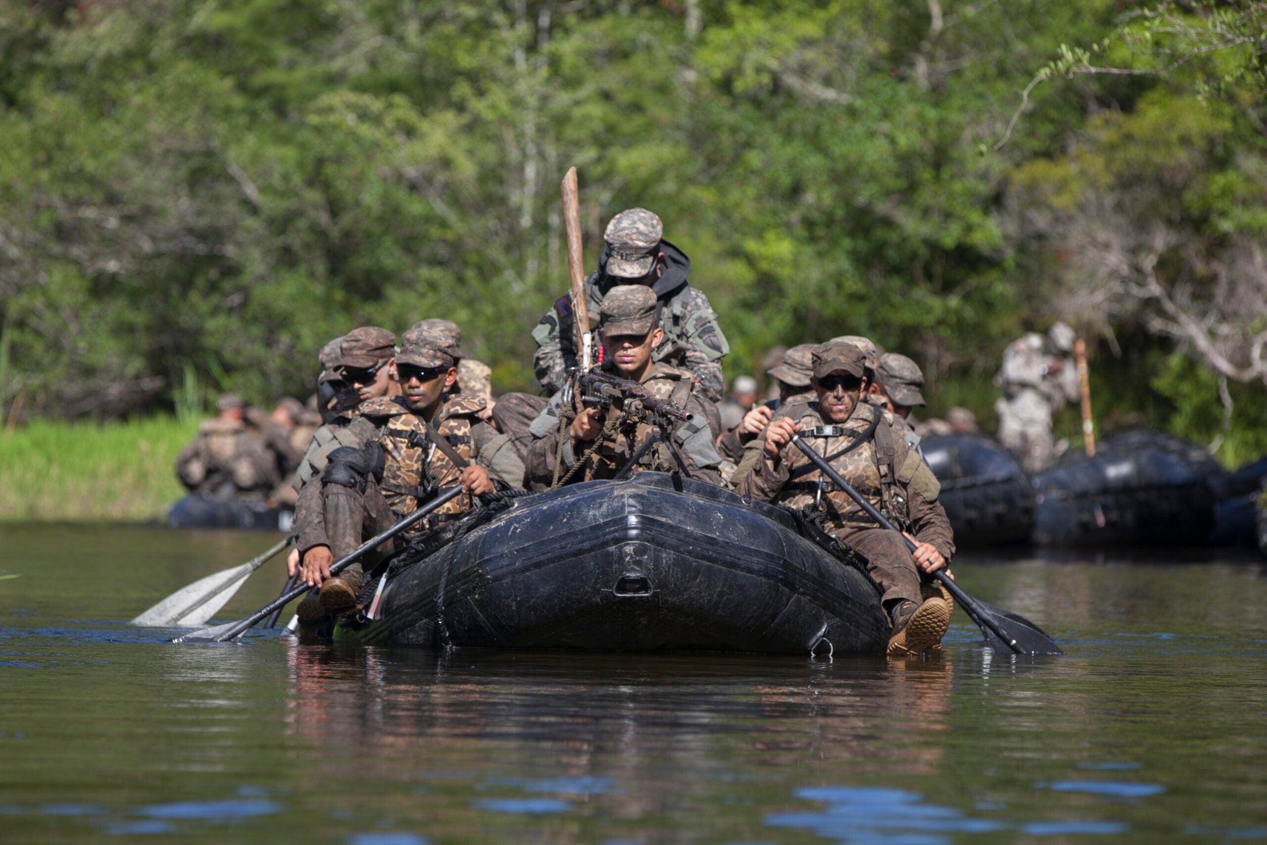A group U.S. Army Ranger students, assigned to the Airborne and Ranger Training Brigade, paddles their zodiac boat down the river to start their their waterborne mission on Camp Rudder, Eglin Air Force Base, Fl., July 7, 2016. The Florida Phase of Ranger School is the third and final phase that these Ranger students must complete to earn the coveted Ranger Tab. (U.S. Army photo by Sgt. Austin Berner/Released)