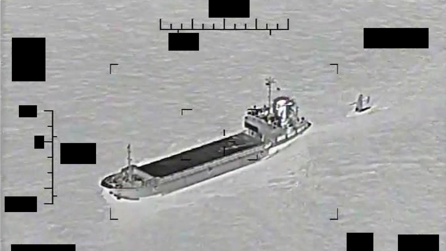 Screenshot of a video showing support ship Shahid Baziar, left, from Iran's Islamic Revolutionary Guard Corps Navy unlawfully towing a Saildrone Explorer unmanned surface vessel in international waters of the Arabian Gulf, Aug. 30. (U.S. Navy photo)