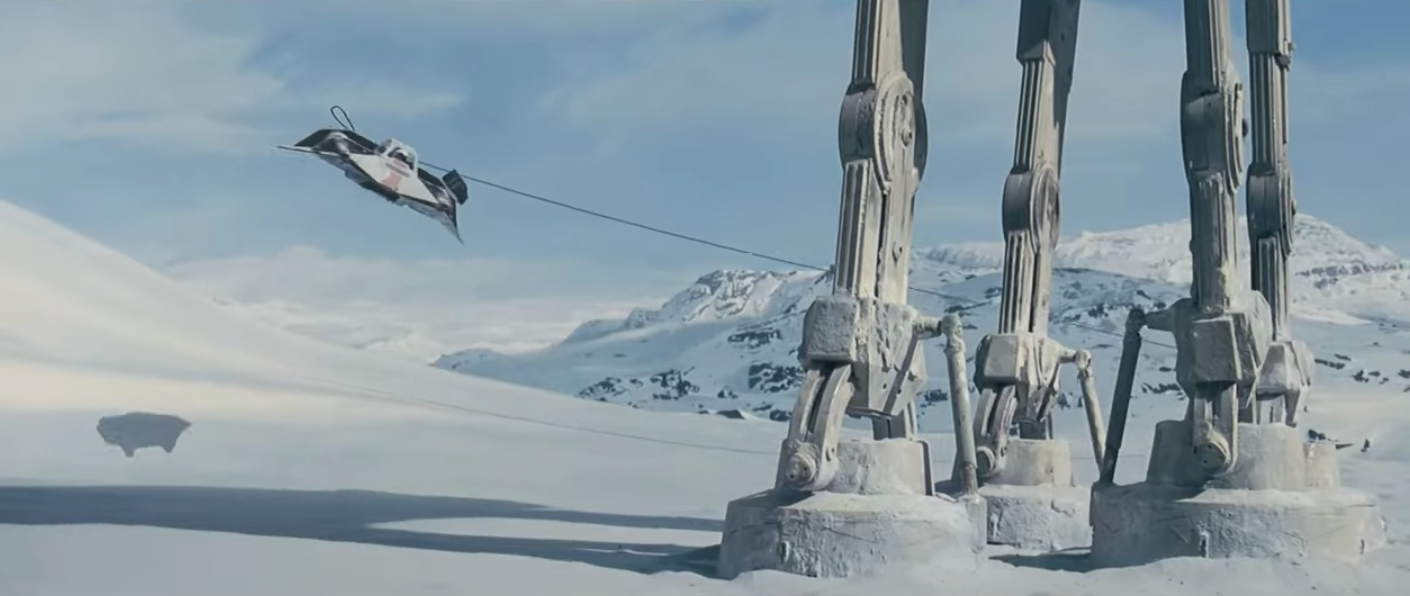 Rebel Alliance pilots steer a snow speeder around an AT-AT walker's legs with a harpoon and tow cable. (Screenshot via Broda/YouTube)