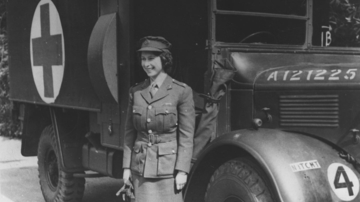 1945: Princess Elizabeth, standing by an Auxiliary Territorial Service first aid truck wearing an officer's uniform. (Photo by Keystone/Getty Images)
