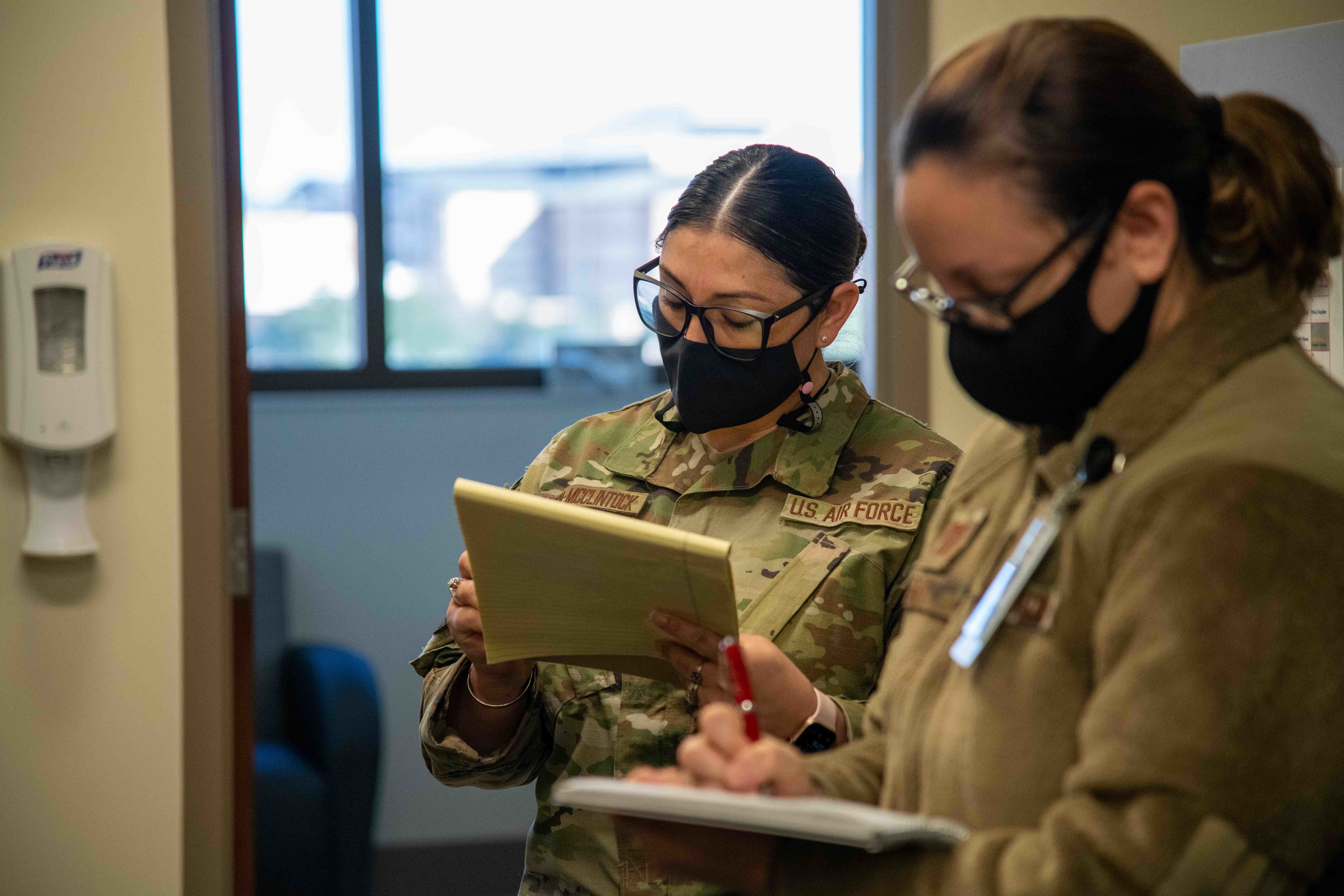 Members of the 559th Medical Squadron’s Mental Health Flight take notes during the MHS GENESIS “Go-Live” at Reid Health Services Center, Joint Base San Antonio-Lackland, Texas, Jan. 22, 2022. MHS GENESIS will become the standard electronic health record for Department of Defense and Veterans Affairs’ medical facilities. (U.S. Air Force photo by Tech. Sgt. Tory Patterson)
