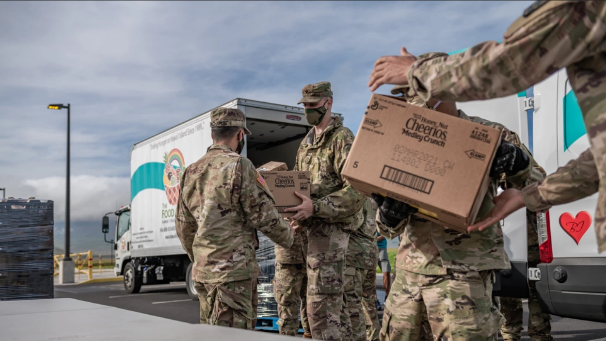 Hawaii National Guard unload food  for a food drive in Waimea, Hawaii in 2020. (Photo by Sgt. John Schoebel, Army National Guard) 