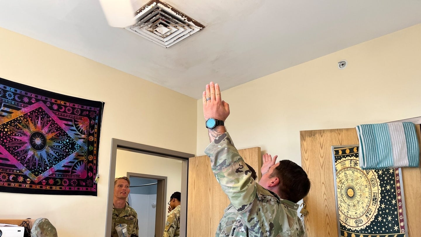 Soldiers inspect mold in the barracks at Fort Stewart. (Photo by Sgt. 1st Class Jason Hull) 