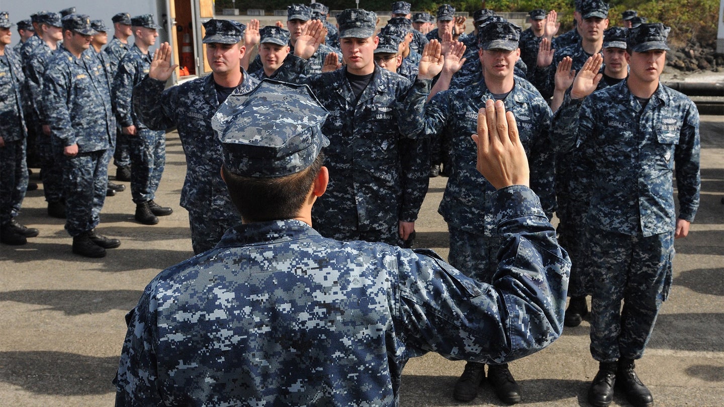 U.S. Navy Cmdr. Gustavo Gutierrez, the commanding officer of the ballistic missile submarine USS Pennsylvania (SSBN 735), re-enlists 18 sailors, Sept. 28, 2012, at Naval Base Kitsap, Wash. (Chief Mass Communication Specialist Ahron Arendes/U.S. Navy)