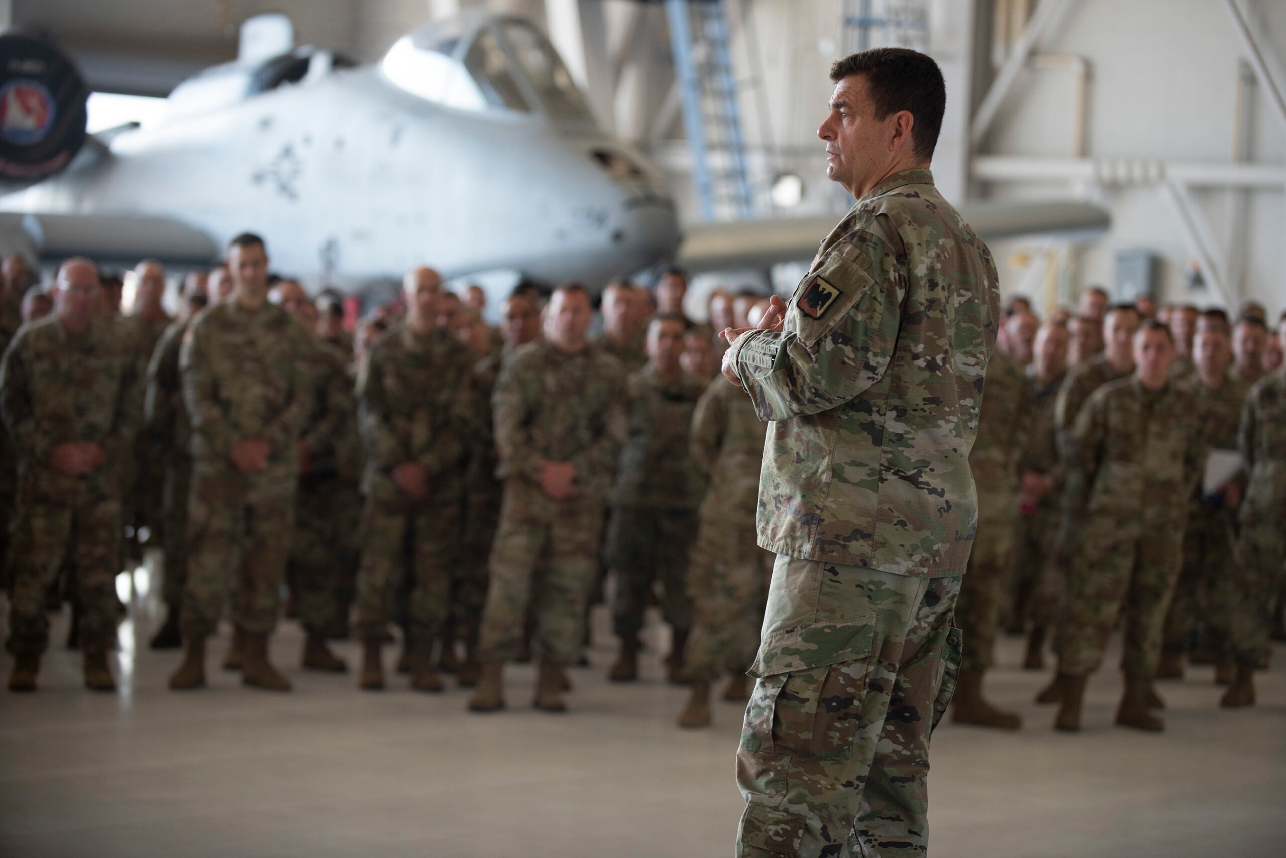 U.S. Air Force Lt. Gen. Michael Loh, director, Air National Guard, speaks to Airmen with the 124th Fighter Wing, Idaho National Guard at Gowen Field, Boise, Idaho, Aug. 20, 2022. While addressing the Airmen he outlined five of his priorities and took candid questions from the audience. (U.S. Air National Guard photo by Master Sgt. Becky Vanshur)