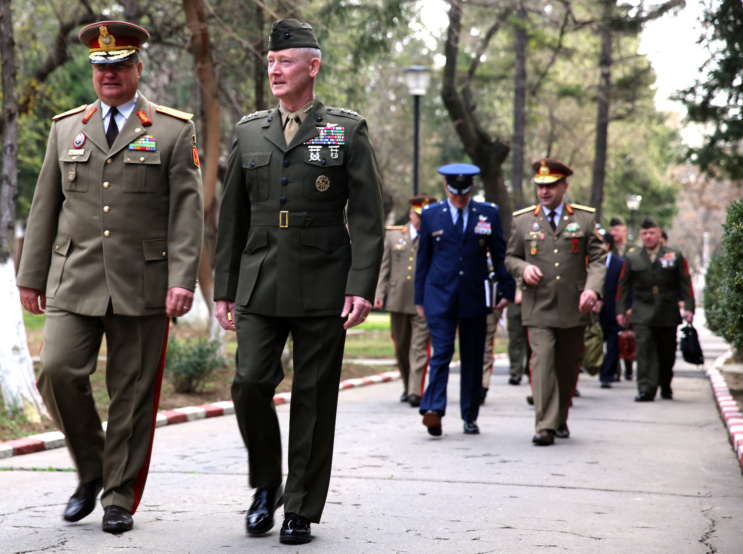 United States Marine Corps Lt. Gen. Richard Tryon, commander of U.S. Marine Corps Forces Command and U.S. Marine Corps Forces, Europe, walks with Romanian Maj. Gen. Nicolae-Ionel Ciuca, chief of Romanian land forces, during Tryon's official visit to Bucharest, March 18, 2014. Tryon visited with Romanian military officials to discuss continuing the good military relationship between the United States and Romania. United States military forces are currently in Romania assigned to Mihail Kogalniceanu Air Base and the two nations work together during much of the Black Sea Rotational Force deployment. Black Sea Rotational Force 14 is a contingent of Marines and sailors tasked with maintaining positive relations with partner nations, regional stability and increasing interoperability while providing the capability for rapid crisis response, as directed by U.S. European Command, in the Black Sea, Balkan and Caucasus regions of Eastern Europe. (Official Marine Corps photo by Lance Cpl. Scott W. Whiting, BSRF PAO/ Released)
