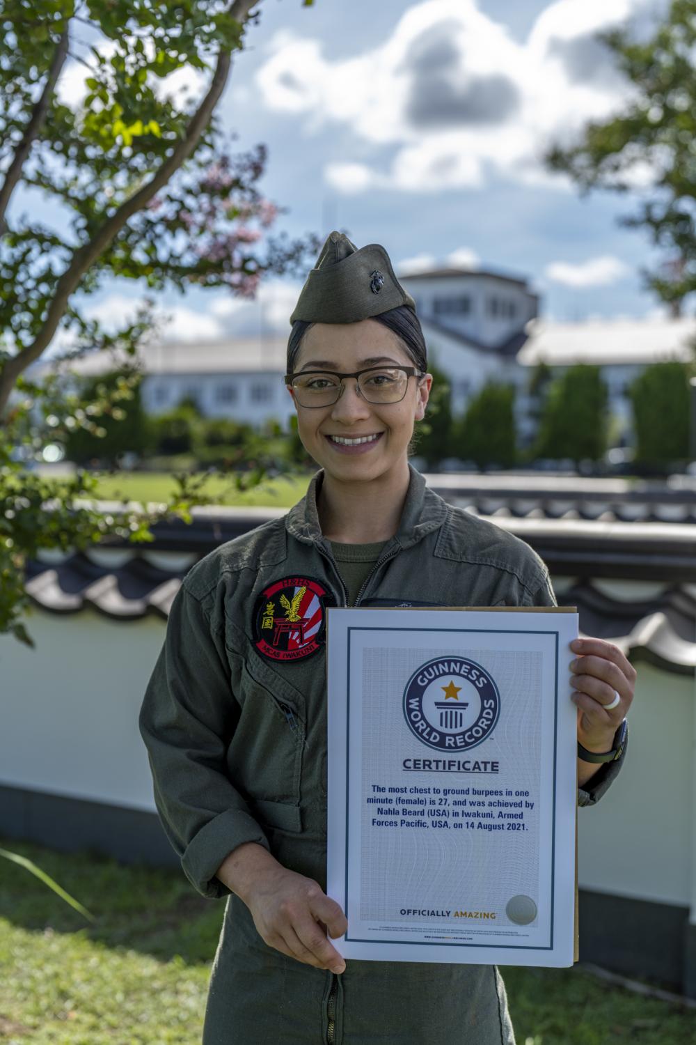 U.S. Marine Corps Sgt. Nahla Beard, an Air Traffic Controller with Headquarters and Headquarters Squadron, displays her award at Marine Corps Air Station Iwakuni, Japan, August 2, 2022. (Cpl. Mitchell Austin/U.S. Marine Corps)