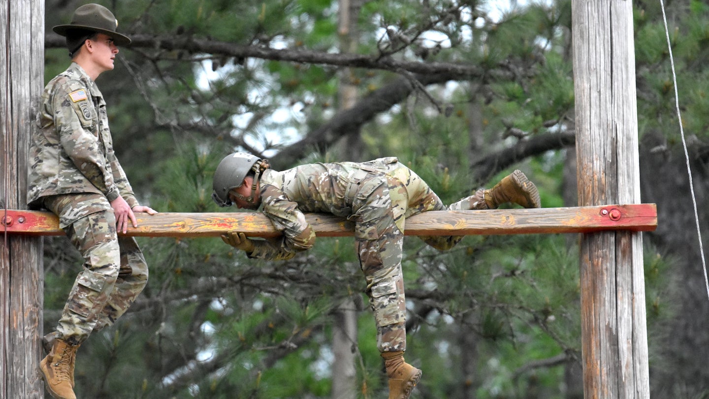 A Basic trainee completes obstacles at Fort Benning's Confidence Course, April 14, 2022.