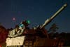 A modernized M1A2 SEPv3 Abrams tank assigned to Bravo Company, 2nd Battalion, 69th Armor Regiment, 2nd Armored Brigade Combat Team, waits in line for night Table VI operator new equipment training at Fort Stewart, Georgia, Sept. 24, 2022. The "Spartan Brigade," 2nd ABCT, 3rd ID, is the Army’s first brigade to complete modernization in accordance with the Army’s new Regionally Aligned Readiness and Modernization Model, or ReARMM, and is on glide path to execute a rotation at the National Training Center at Fort Irwin, California, to validate its readiness and proficiency to deploy, fight and win wherever and whenever the nation calls. (U.S. Army photo by 1st Lt. Jacob Swinson, Executive Officer for Bravo Company, 2nd Bn., 69th AR, 2nd ABCT)