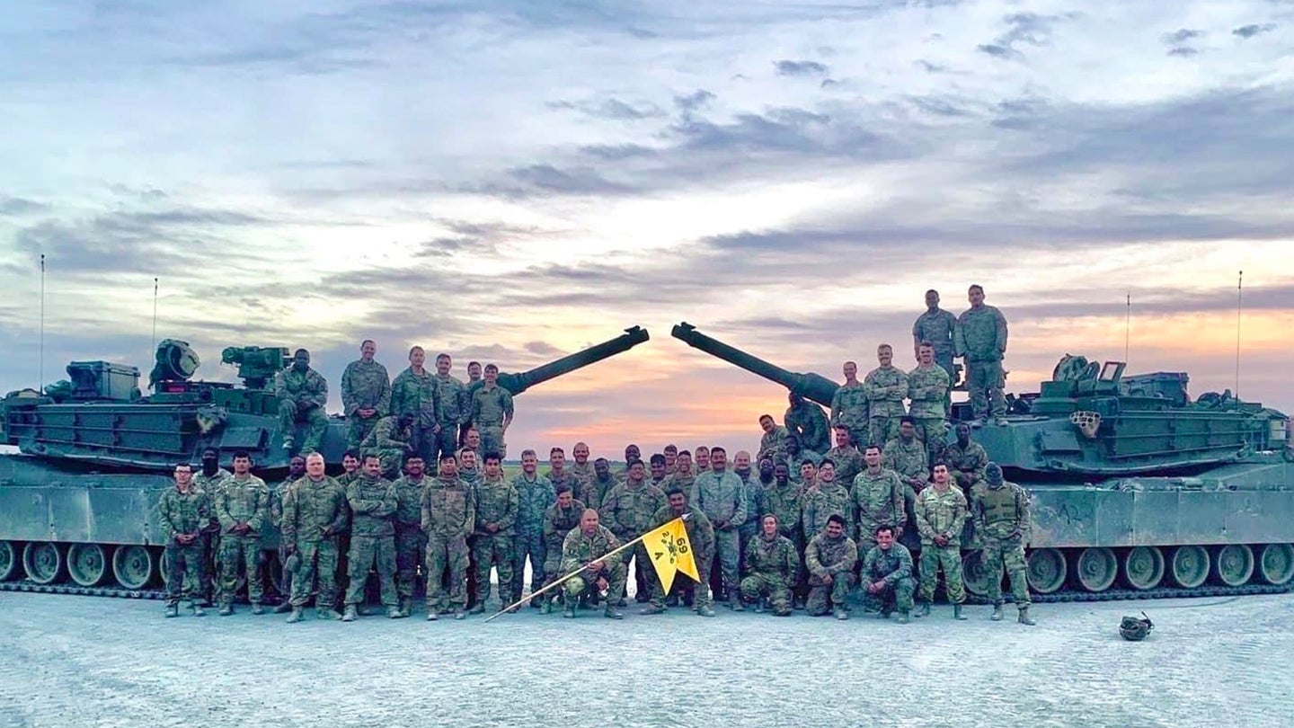 Alpha Company, 2nd Battalion, 69th Armor Regiment, 2nd Armored Brigade Combat Team, poses for a company photo after completing day and night Table VI operator new equipment training that concludes modernization for the "Spartan Brigade," 2nd ABCT, 3rd Infantry Division, at Fort Stewart, Georgia, Sept. 28, 2022. (Courtesy Photo/U.S. Army) 