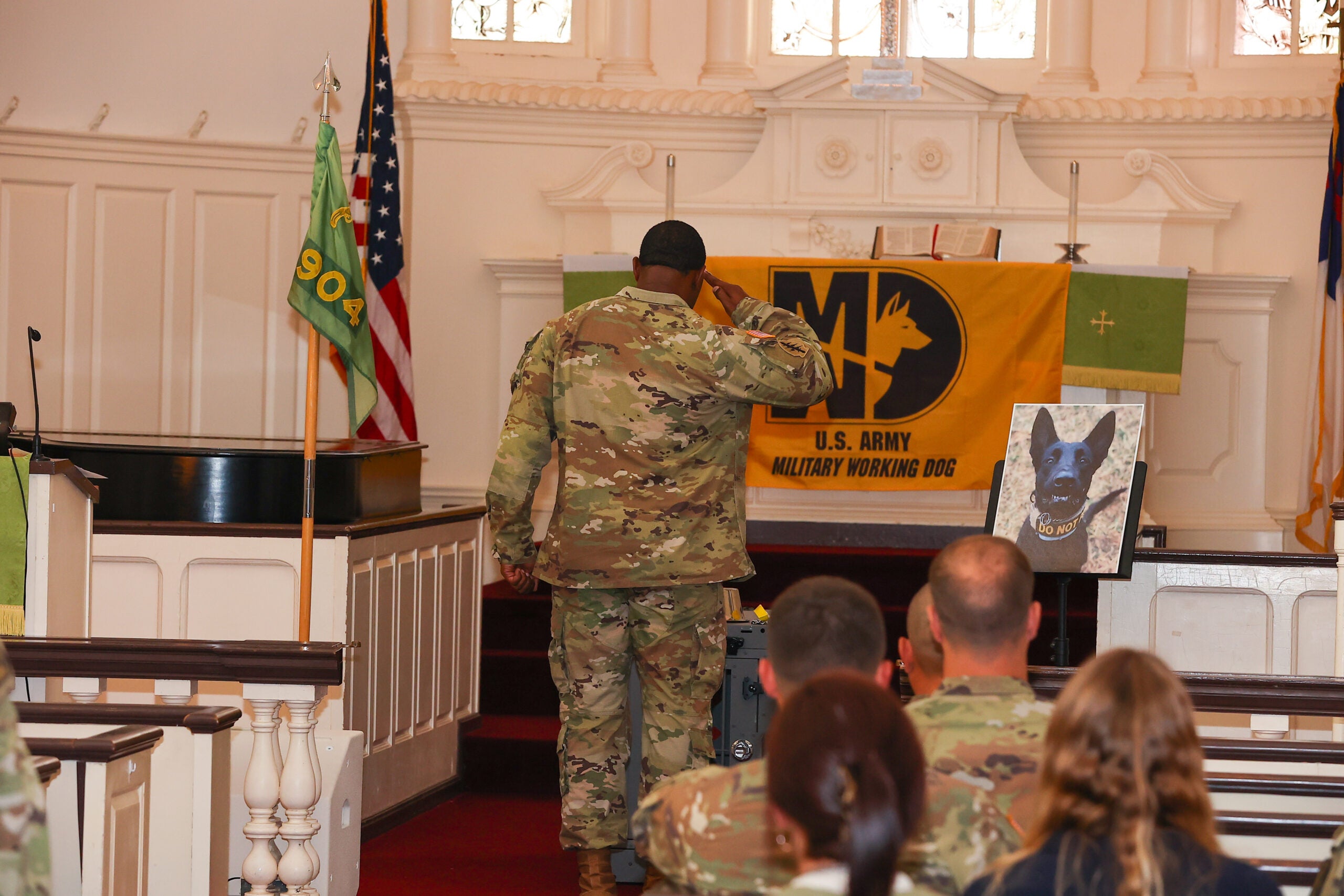 FORT BENNING, Ga – Soldiers from the 904th Military Working Dog Detachment, attend the memorial ceremony of MWD Ccruz, October 13, 2022 at the Infantry Chapel. MWD Ccruz 4 year military career with Spc. Ramos from both Fort Campbell and Fort Benning where his duties consisted of Military Working Dog demonstrations, Law Enforcement Support and Force Protection support for the Communities on the Installation. (U.S. Army photo by Markeith Horace, Fort Benning Maneuver Center of Excellence photographer)