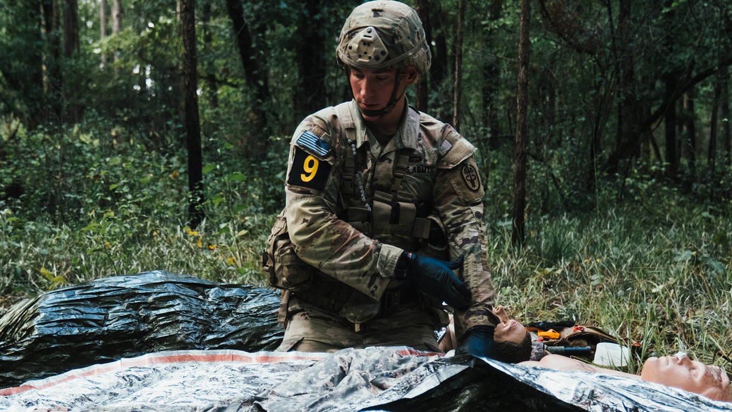 U.S. Army Sgt. Garret Paulson, representing the U.S. Army Medical Command, performs tactical combat casualty care on simulated casualties during the Army's first-ever Best Squad Competition on Fort Bragg, North Carolina, Oct. 01, 2022. (Sgt. Fransico Isreal/U.S. Army)