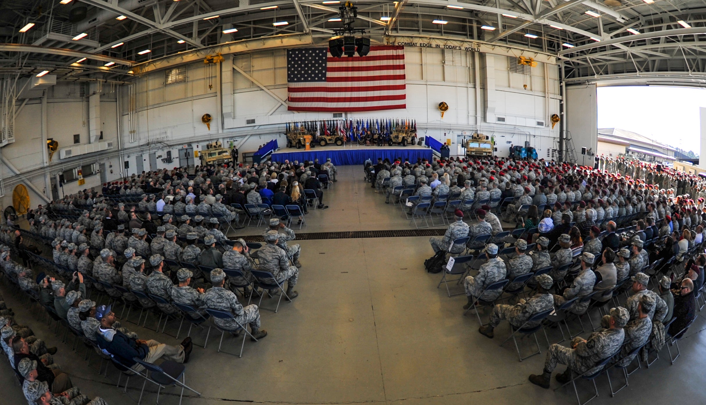 Air Commandos and members of the community gather in the Freedom Hangar for a ceremony recognizing then-Master Sgt. Ivan Ruiz, a pararescueman from the 56th Rescue Squadron, Royal Air Force Lakenheath, England, who was awarded the Air Force Cross on Hurlburt Field, Fla., Dec. 17, 2014. (Senior Airman Christopher Callaway/U.S. Air Force)