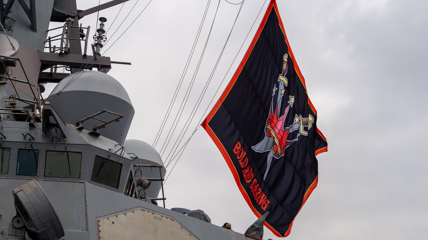 The guided missile destroyer USS Decatur flies its battle flag. (U.S. Navy photo)