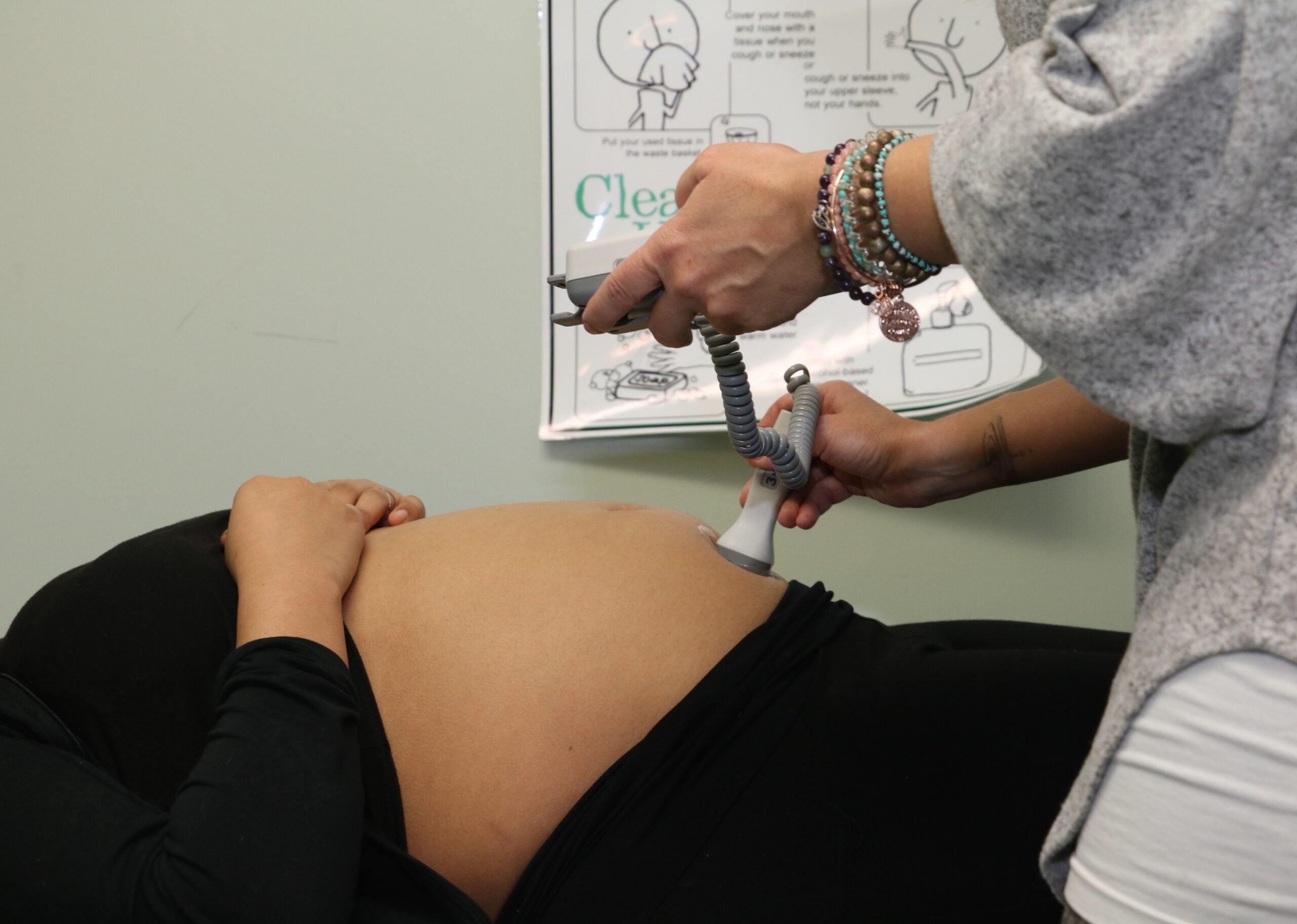 Certified Nurse Midwife, Maj. Nicole Sampson, measures baby's heart rate during the health assessment portion of a Centering Pregnancy session at Blanchfield Army Community Hospital in 2018. Blanchfield is resuming Centering Pregnancy, which brings expectant mothers together in healthcare groups of 8 to 12 women, for 10 two-hour sessions, to share in their prenatal healthcare journey. Each session features a health assessment, interactive learning and community support. U.S. Army photo by Maria Yager.
