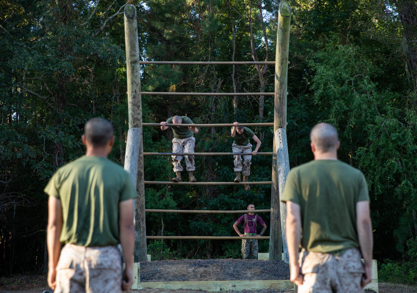Recruits with Oscar Company, 4th Recruit Training Battalion, execute obstacles on the Confidence Course aboard Marine Corps Recruit Depot Parris Island, S.C. October 20, 2022. The Confidence Course tests the recruits abilities of performing upper body strength and overcoming fear. (U.S. Marine Corps photo by Lance Cpl. Loriann Dauscher)