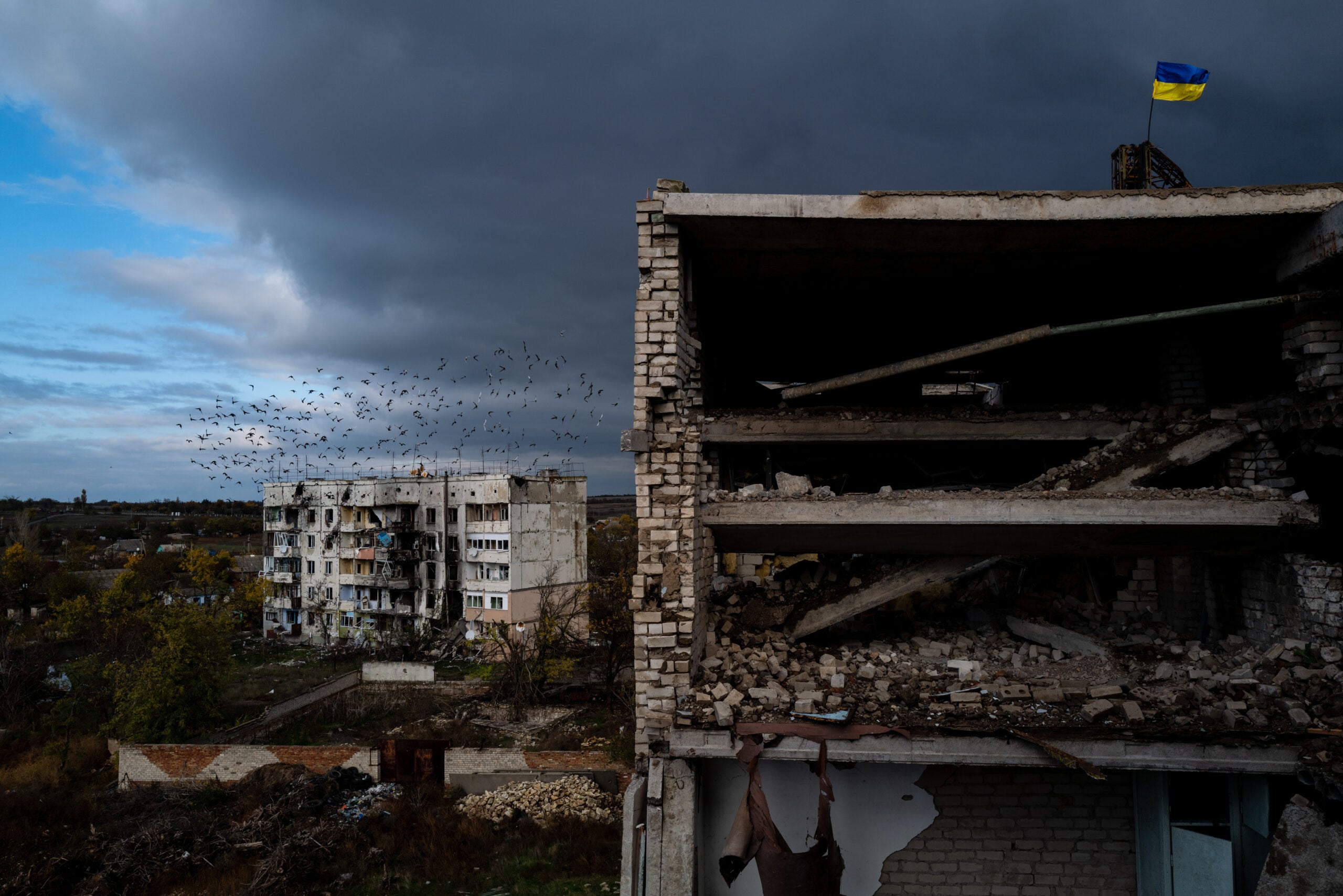 KHERSON, UKRAINE - OCTOBER 26: An apartment building is seen ruined in the recently recaptured village of Archangelske, Kherson Oblast, Ukraine on 26 Oct. 2022 (Photo by Wolfgang Schwan/Anadolu Agency via Getty Images)
