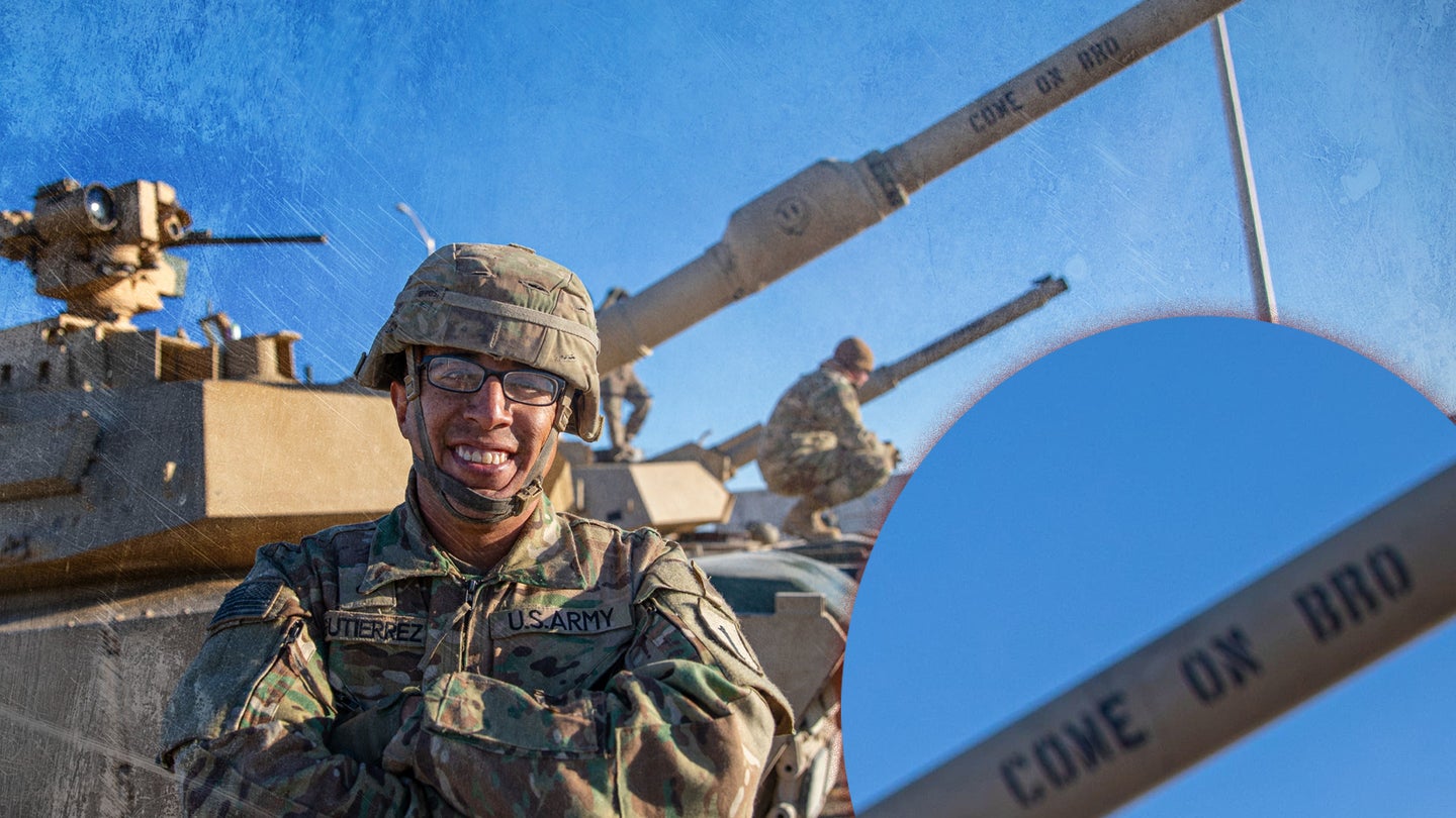 U.S. Army Pfc. OJ Gutierrez, a tanker assigned to the 2nd Battalion, 70th Armor Regiment, 2nd Armored Brigade Combat Team, 1st Infantry Division, stands in front of an M1A1 Abrams Tank at the Douthit Gunnery Complex on Fort Riley, Kansas, Oct. 19, 2022. Gutierrez, along with his unit, was conducting live-fire tank gunnery for qualification. (Sgt. Jared Simmons/U.S. Army)