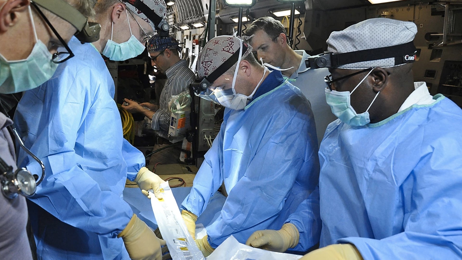 A medical crew from 59 Medical Wing at Joint Base San Antonio Lackland, practices medical procedures on a C-17 Globemaster III during a presidential support mission to Havana, Cuba, March, 2016. (Maj. Wayne Capps/U.S. Air Force)