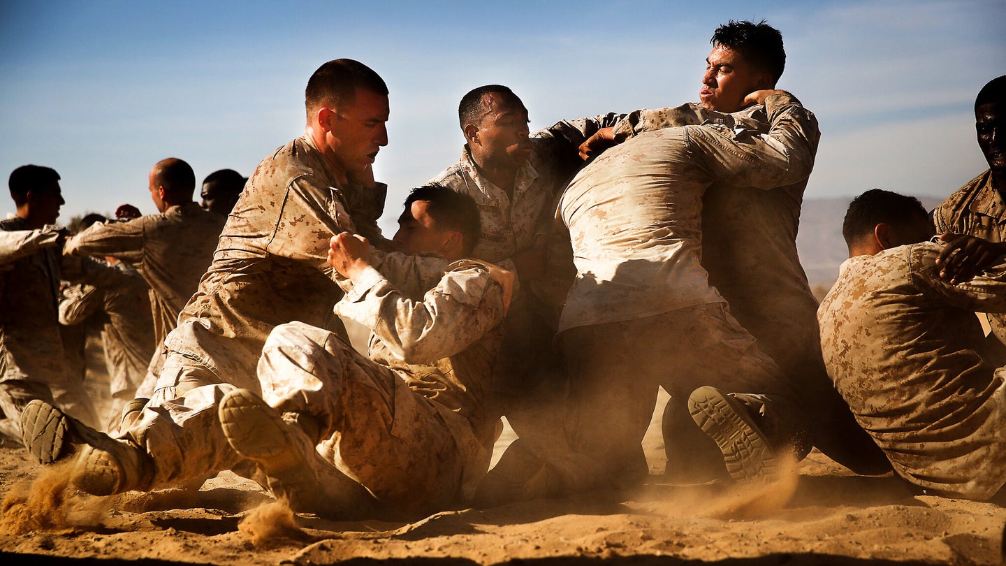 Students of Martial Arts Instructor Course 2-14 grapple against each other during their final exercise on Marine Corps Air Ground Combat Center, Twentynine Palms, California, April 17, 2014. (Cpl. Ali Azimi/U.S. Marine Corps)