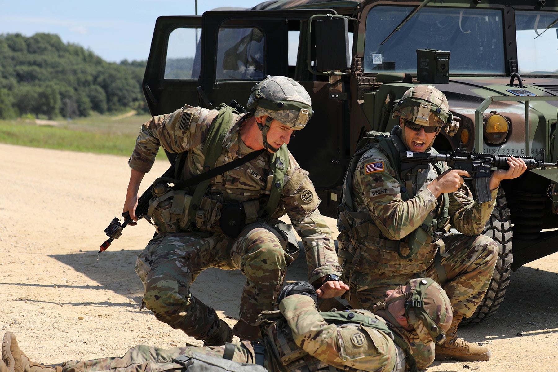 U.S. Army Reserve Soldiers assigned to the 888th Movement Control Team (MCT) Cranston, Rhode Island, assist a simulated-injured Soldier during convoy operations lane training at CSTX 86-22-02 at Fort McCoy, Wisconsin, August 16, 2022. In this scenario, Soldiers trained on reacting to small arms fire and evacuating a casualty.

(U.S. Army Reserve photo by Staff Sgt. David Lietz)