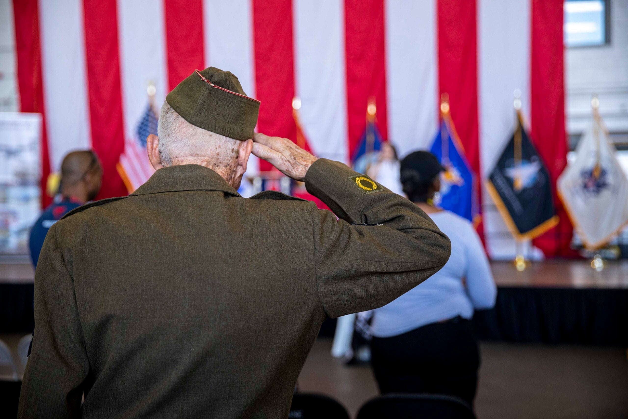 U.S Army World War II Veteran Andre Chappaz, who served from 1943-1946, salutes the flag during the national anthem in Hartsfield-Jackson Atlanta International Airport, Georgia, Nov. 3, 2022. The Marines with the 22nd MEU are participating in the Delta Airlines Veterans Day air show to showcase and highlight military air power. (U.S. Marine Corps photo by Cpl. Yvonna Guyette)