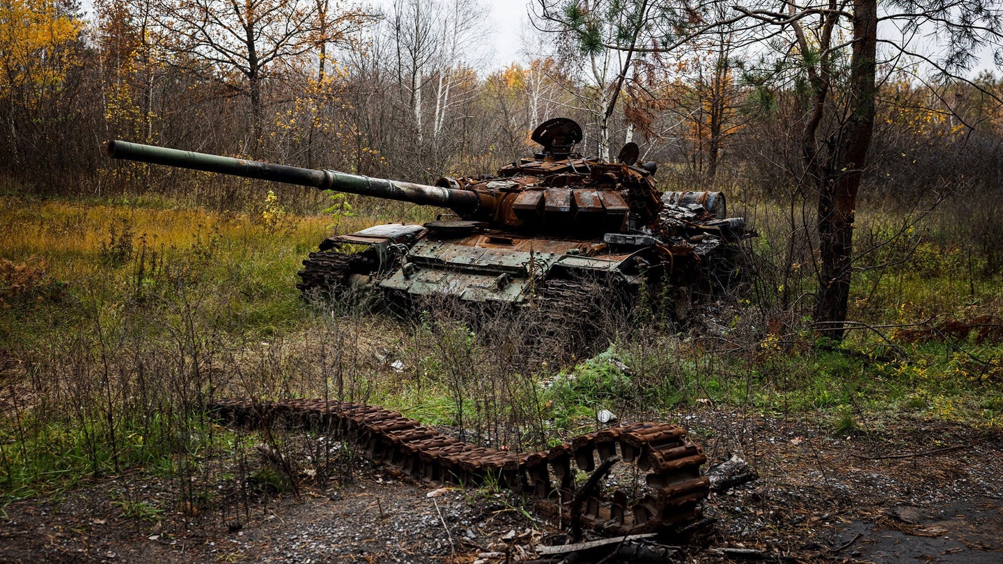 This photograph taken on November 1, 2022, shows a destroyed tank near the recently recaptured Ukrainian village of Yampil, eastern Ukraine. (Photo by DIMITAR DILKOFF/AFP via Getty Images)
